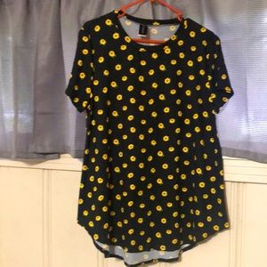 Black blouse embellished with sunflowers.